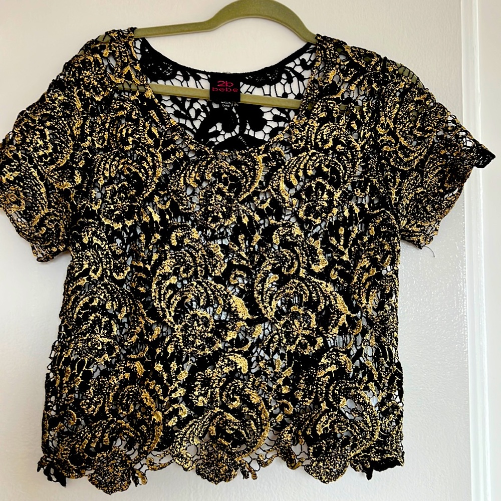 Bebe Crocheted black-and-gold 100% cotton top.  See through. Size XLarge.